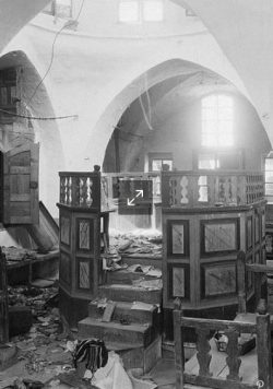 Torn sacred books and broken furniture in a synagogue desecrated by Arab rioters in Hebron, 1929