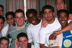 Teenage Israeli and Israeli Ethiopian boys sharing friendship.