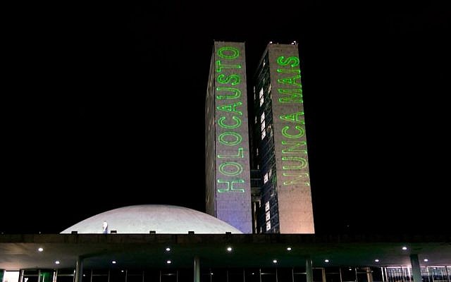 The words, "Holocaust Never Again" in Portuguese on Brazil's National Congress Buildings. 