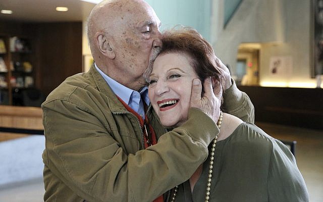 In this Wednesday, April 11, 2018, photo, childhood Holocaust survivors Simon Gronowski and Alice Gerstel Weit embrace at the Los Angeles Holocaust Museum. (AP Photo/Reed Saxon)