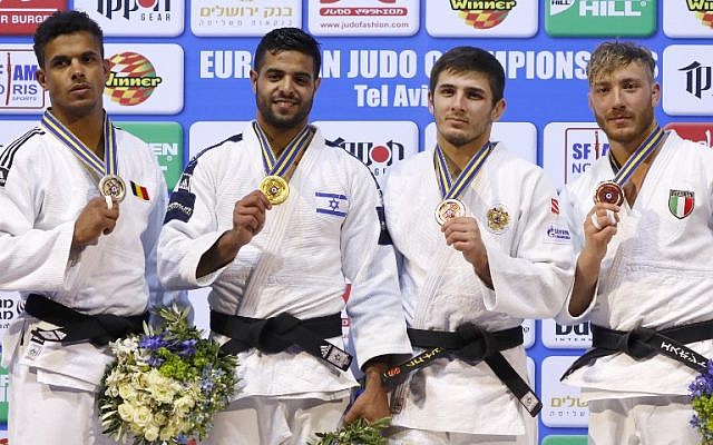 (L-R) Russia’s Mikhail Puliaev, Japan’s Hifumi Abe, Georgia’s Vazha Margvelashvili and Israel’s Tal Flicker celebrate on the podium during the medal ceremony at the World Judo Championships in Budapest on August 29, 2017. (AFP Photo/Attila Kisbenedek)