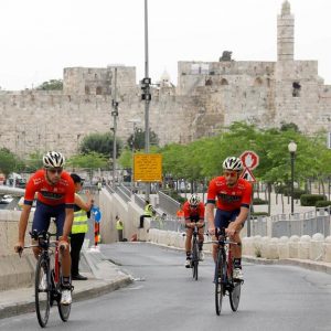 Italian cyclist Niccolo Bonifazio (R) of Bahrain Merida team and teammates warm up along the walls of Jerusalem's old city before the start of the first stage of the Giro d'Italia cycling race, a 9.7km individual time trial in Jerusalem, Israel, 04 May 2018. Abir Sultan / EPA