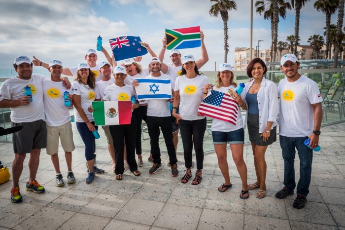 The Pan American Colibri Swim team members and their countries flags. Photo credit: Charl Rorich