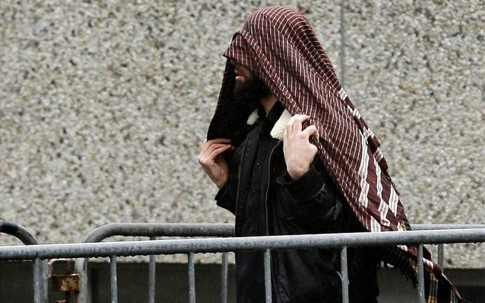 An unidentified supporter of the 'Hofstad' terror group arrives at a trial for the group's members in Amsterdam, The Netherlands, Friday, March 10, 2006. The group includes Mohammed Bouyeri, the convicted murderer of filmmaker Theo van Gogh. (AP Photo/ Fred Ernst)